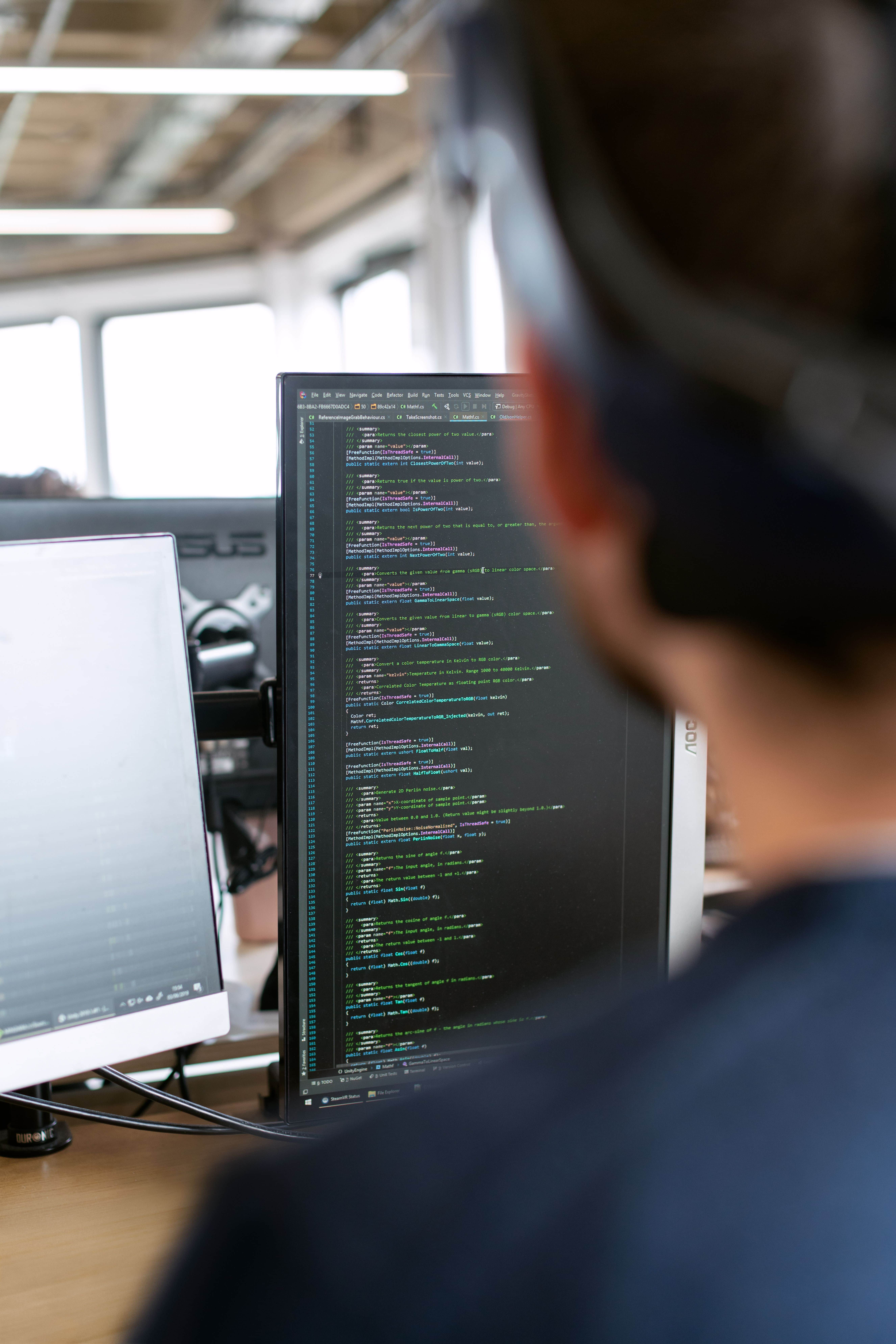 Developer reviewing code on screen